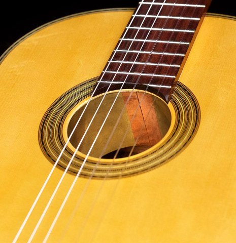 The soundboard, rosette and tornavoz of a 2019 Luis Fernandez de Cordoba &quot;Homenaje a Torres&quot; classical guitar made with spruce and Indian laurel.