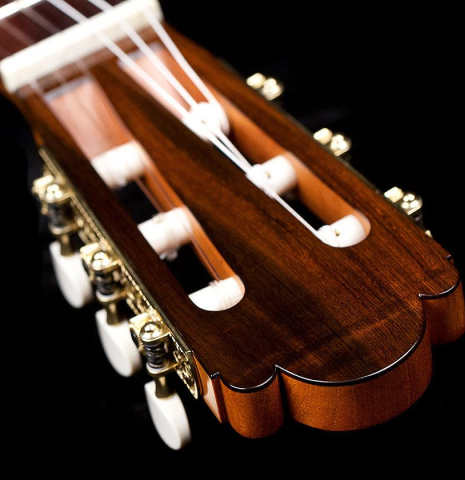 The headstock and tuners of a 2019 Luis Fernandez de Cordoba &quot;Homenaje a Torres&quot; classical guitar made with spruce and Indian laurel.