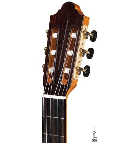 The headstock and tuning machines of a new Cordoba Luthier Select Series "Friederich" made of cedar and Indian rosewood on a white background