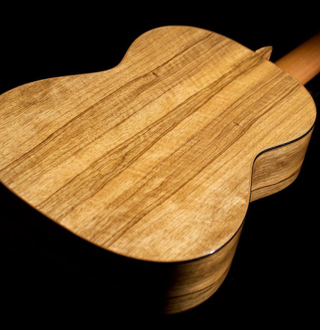 The back of a 2020 Luis Fernandez de Cordoba classical guitar made of spruce and black limba wood.