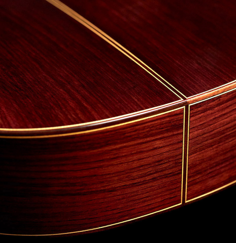 This is the back and sides of a Cordoba "Double Top 25th Anniversary" classical guitar built in 2022. The back and sides are made from palo escrito.