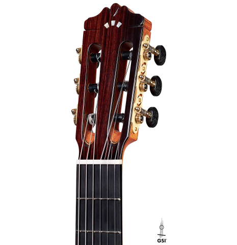 This is the headstock of a Cordoba "Double Top 25th Anniversary" classical guitar built in 2022 on a white background. This guitar has a cedar soundboard and palo escrito back and sides.