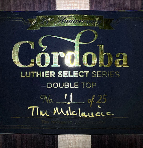 This is the label of a Cordoba "Double Top 25th Anniversary" classical guitar built in 2022. This guitar has a cedar soundboard and palo escrito back and sides.