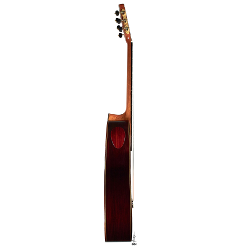 This is the side view of a Cordoba "Double Top 25th Anniversary" classical guitar built in 2022 on a white background. This guitar has a cedar soundboard and palo escrito back and sides.