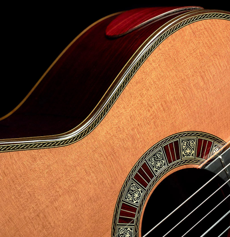 This is a Cordoba "Double Top 25th Anniversary" classical guitar built in 2022. This guitar has a cedar soundboard and palo escrito back and sides.