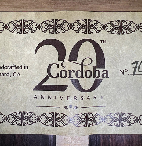 The label of a 2022 Cordoba &quot;20th Anniversary&quot; classical guitar made of spruce and African rosewood