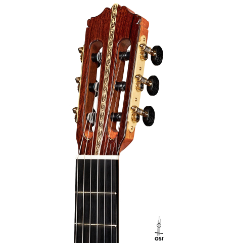 The headstock of a 2022 Cordoba &quot;20th Anniversary&quot; classical guitar made of spruce and African rosewood