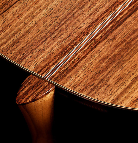 The heel, back binding and purfling of a Cordoba Guitars Master Series "Torres Lefty" classical guitar made of cedar and Indian rosewood