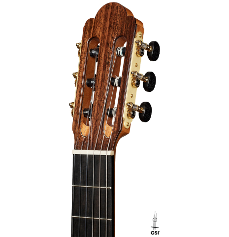 The headstock of a Cordoba Guitars Master Series "Torres Lefty" classical guitar made of cedar and Indian rosewood