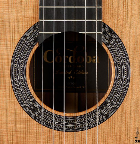 The rosette of a Cordoba Guitars Master Series "Torres Lefty" classical guitar made of cedar and Indian rosewood
