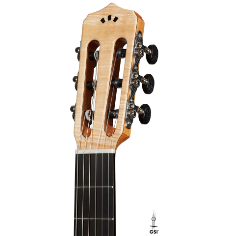 The headstock of a Cordoba Guitars "Fusion 12 White Sands" classical crossover guitar made of spruce and maple