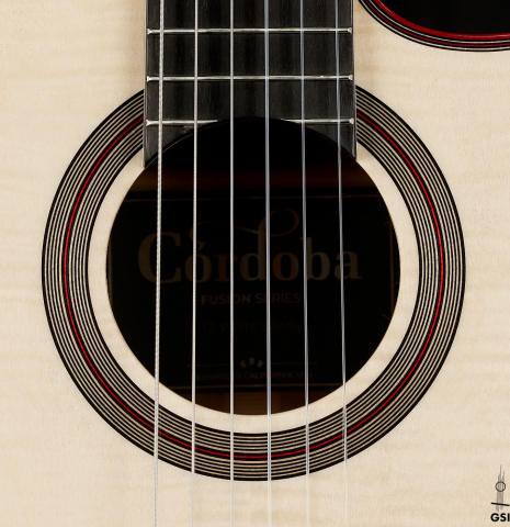 The rosette of a Cordoba Guitars "Fusion 12 White Sands" classical crossover guitar made of spruce and maple