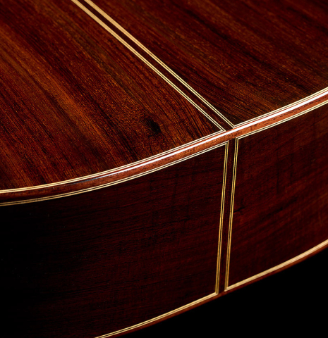 The back and sides at the foot of a 2026 Andy Culpepper "15th Anniversary" SP/CSAR classical guitar made of spruce and CSA rosewood