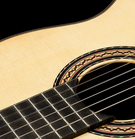 The soundboard and rosette of a 2024 Andy Culpepper classical guitar made of spruce and CSA rosewood