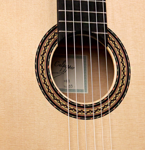 The soundboard of a 2021 Andy Culpepper classical guitar made of spruce and cypress