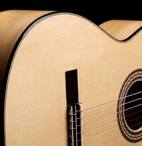 The lower bout of a 2021 Andy Culpepper classical guitar made of spruce and cypress