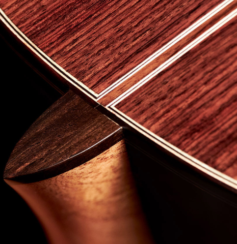 The heel of a 2022 Andy Culpepper &quot;Lefty&quot; classical guitar made of spruce and Indian rosewood