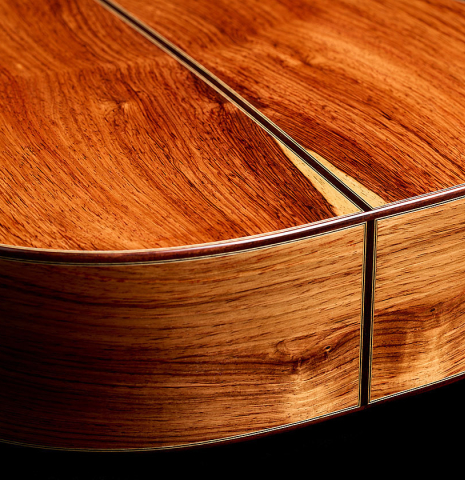 The back and sides at the foot of a 2025 Andy Culpepper classical guitar made of cedar and Honduran rosewood