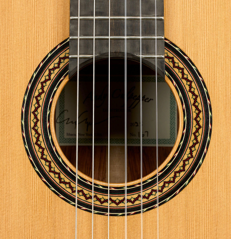 The rosette of a 2025 Andy Culpepper classical guitar made of cedar and Honduran rosewood