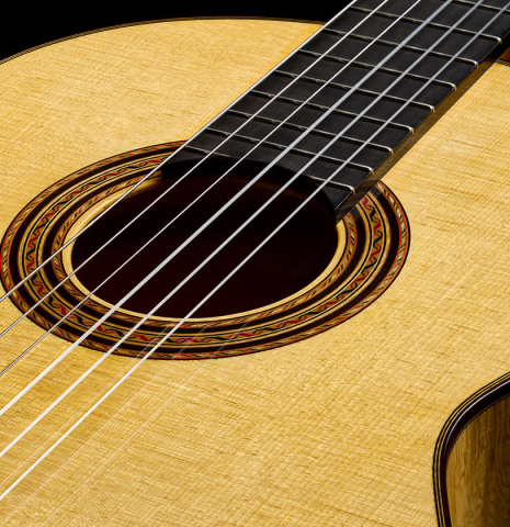 The soundboard and rosette of a 2026 Andy Culpepper "Santos" classical guitar made of spruce and maple