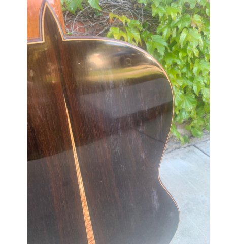 The white spots on the back of a 2020 Yulong Guo "Granada" classical guitar made of spruce and CSA rosewood