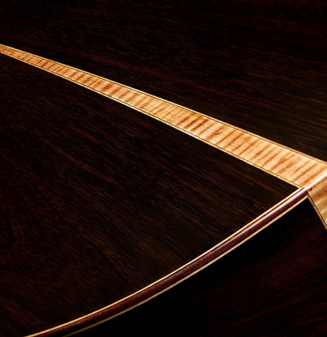 The back and sides at the foot of a 2020 Yulong Guo "Granada" classical guitar made of spruce and CSA rosewood