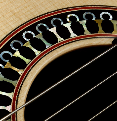 The top and rosette detail of a 2020 Yulong Guo "Granada" classical guitar made of spruce and CSA rosewood