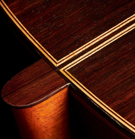 The back, heel, binding and purfling of a 1998 David Daily classical guitar made of cedar and Indian rosewood