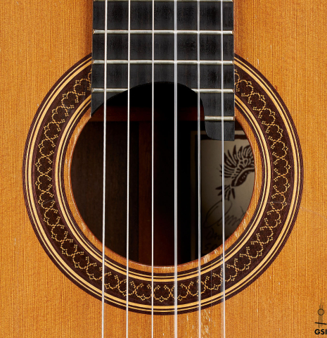 The rosette of a 1998 David Daily classical guitar made of cedar and Indian rosewood