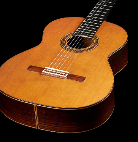 The top and sides at the foot of a 1998 David Daily classical guitar made of cedar and Indian rosewood