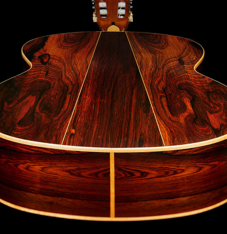The back and sides at the foot of a 1987 David Daily classical guitar made of spruce and CSA rosewood