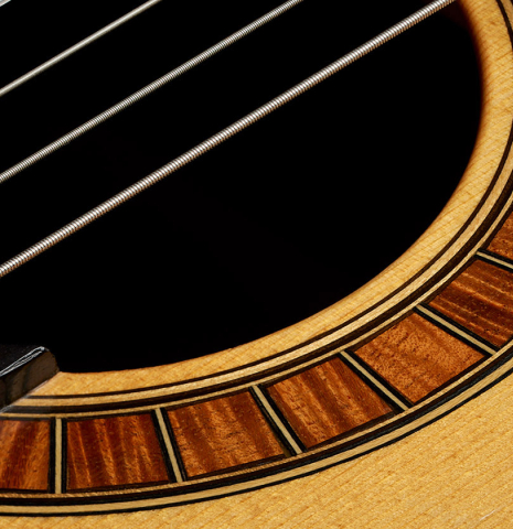 Detailed close-up of the rosette of a 1987 David Daily classical guitar made of spruce and CSA rosewood