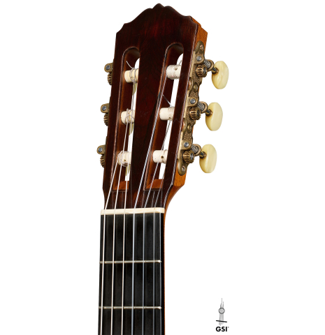 The headstock of a 1999 Matthias Dammann double-top classical guitar made of cedar and CSA rosewood