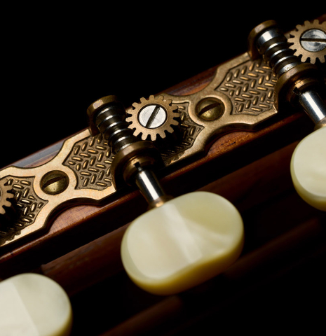 The tuning machines of a 1999 Matthias Dammann double-top classical guitar made of cedar and CSA rosewood