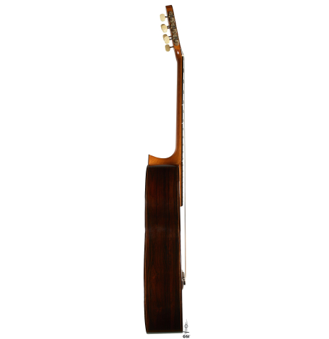 The side of a 1999 Matthias Dammann double-top classical guitar made of cedar and CSA rosewood