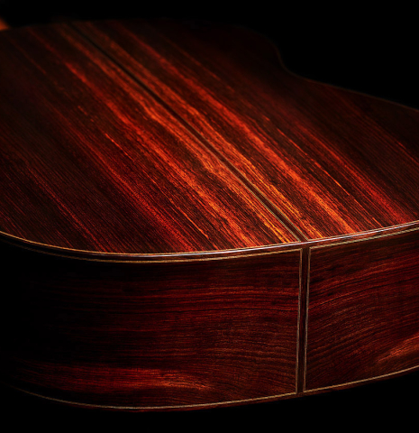 The back and sides at the foot of a 2023 Thomas Dauge classical guitar made of spruce and Indian rosewood