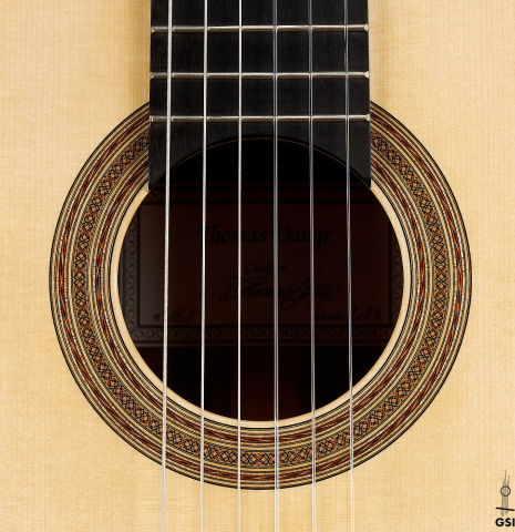 The rosette of a 2023 Thomas Dauge classical guitar made of spruce and Indian rosewood