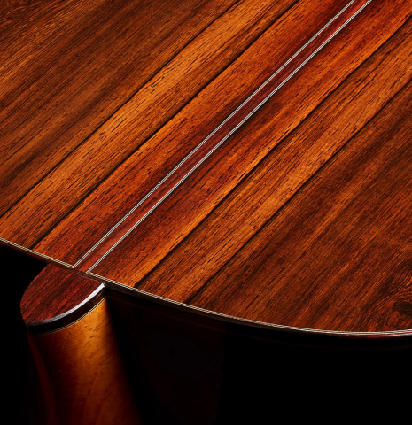 The heel, back binding and purfling of a 2025 Thomas Dauge classical guitar made of spruce and African rosewood