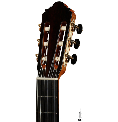 The headstock of a 2025 Thomas Dauge classical guitar made of spruce and African rosewood