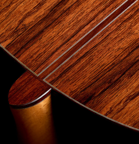 The heel, back binding and purfling of a 2026 Thomas Dauge classical guitar made of spruce and African rosewood