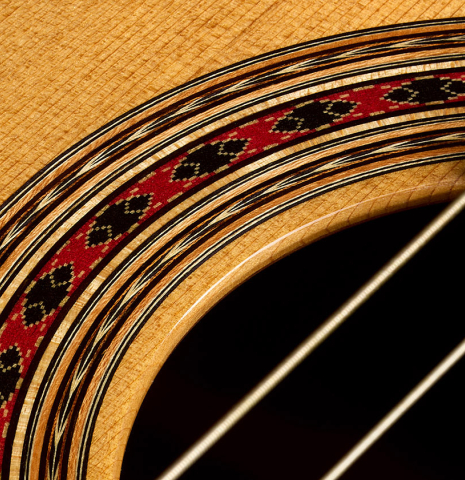 Detailed closeup of the rosette of a 2019 Thomas Dauge "d'après Daniel Friederich" classical guitar made of cedar and Indian rosewood