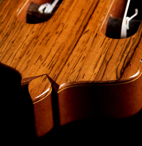 The carved headstock of a 1993 Christopher Dean classical guitar made of spruce and Indian rosewood