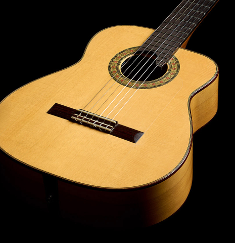 The soundboard and sides of a 2012 Robert Desmond "cutaway w/electronics" classical guitar made of spruce and cypress