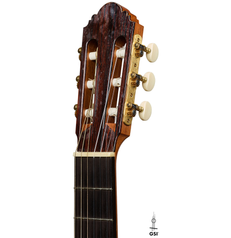 The headstock of a 2012 Robert Desmond "cutaway w/electronics" classical guitar made of spruce and cypress