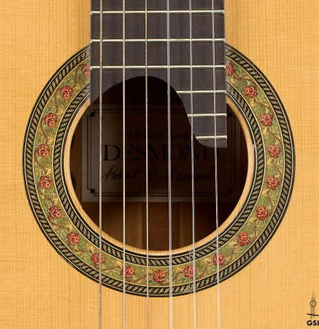 The rosette of a 2012 Robert Desmond "cutaway w/electronics" classical guitar made of spruce and cypress