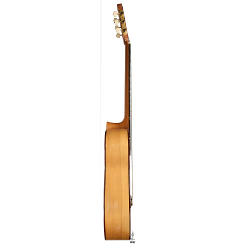 The side of a 2012 Robert Desmond "cutaway w/electronics" classical guitar made of spruce and cypress