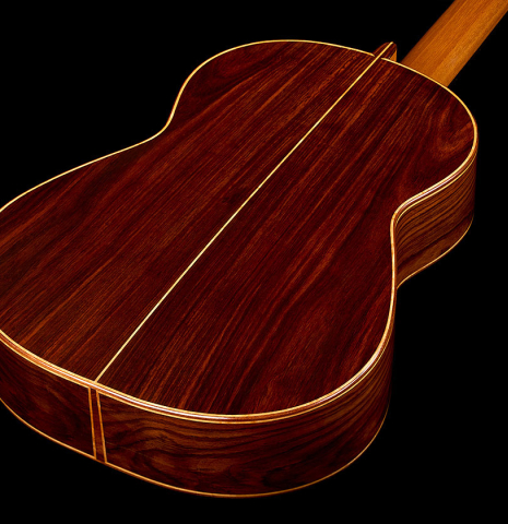 The back and sides of a 2015 Ethan Deutsch w/pegs flamenco negra guitar made of spruce and CSA rosewood