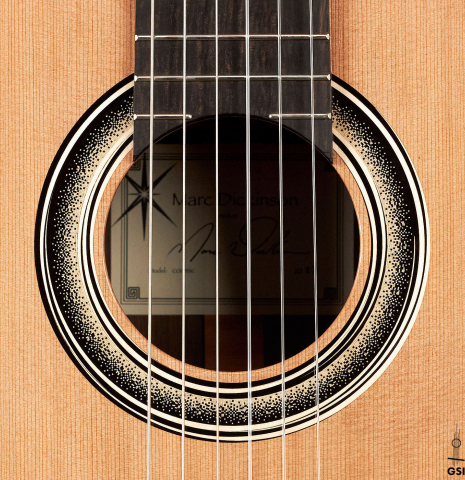 The rosette of a 2023 Marc Dickinson “Cosmic” classical guitar made of cedar and Indian rosewood