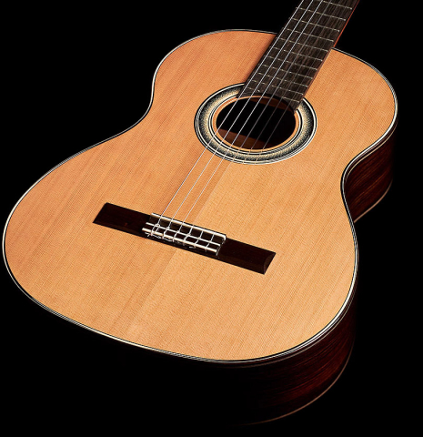 The top and sides of a 2023 Marc Dickinson “Cosmic” classical guitar made of cedar and Indian rosewood