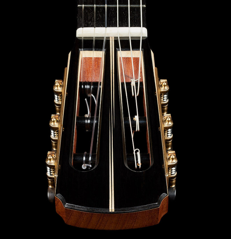 The headstock veneer with inlays of a 2024 Marc Dickinson “Cosmic” classical guitar made of cedar and Indian rosewood